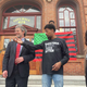 Attorney Mark Mishler, left, stands with his client Lexis Figuereo, center, with Black Lives Matter activist Samira Sangare on the steps of City Hall on Tuesday, April 14, 2022.
